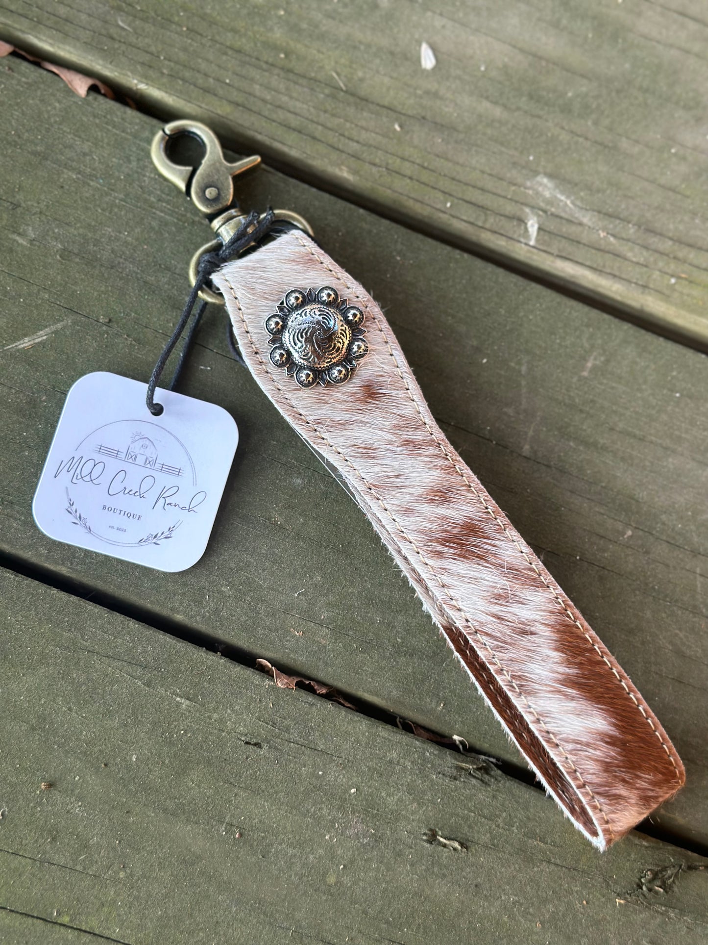 Cow hide strap with button keychain